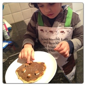 Little man Decorating his Pancake